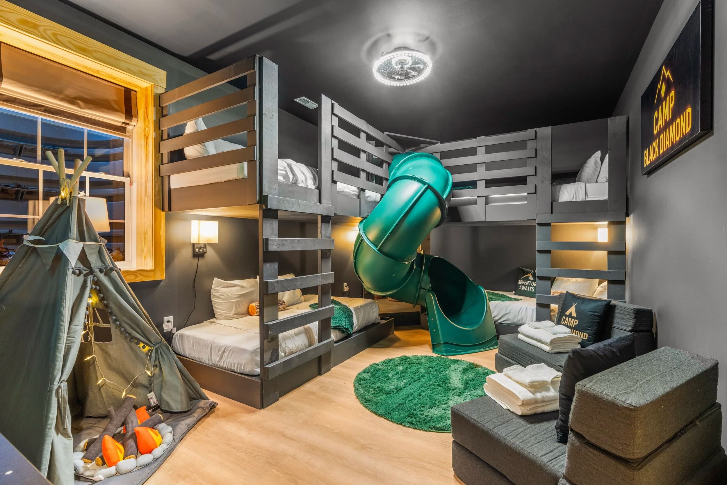 Camp Black Diamond bunk room with slide