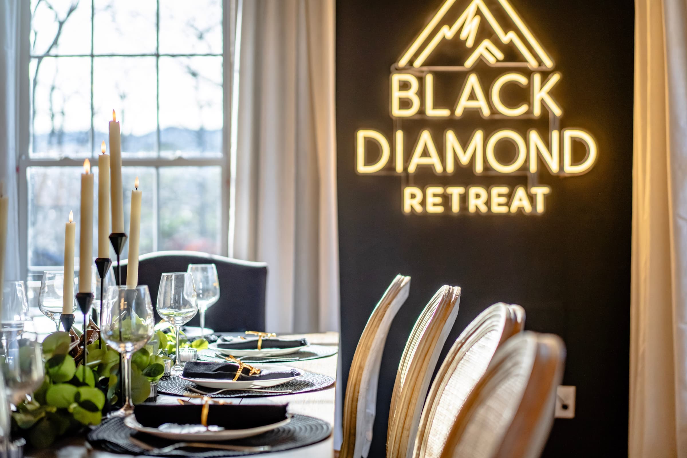 Dining room with Black Diamond neon sign